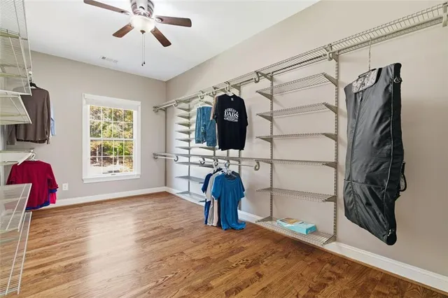 a kitchen with granite countertop cabinets stainless steel appliances a sink and window