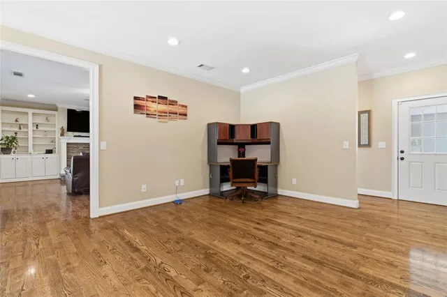 a kitchen with granite countertop a refrigerator stove top oven and sink