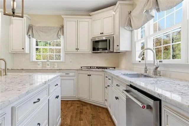 a view of a backyard with sitting area