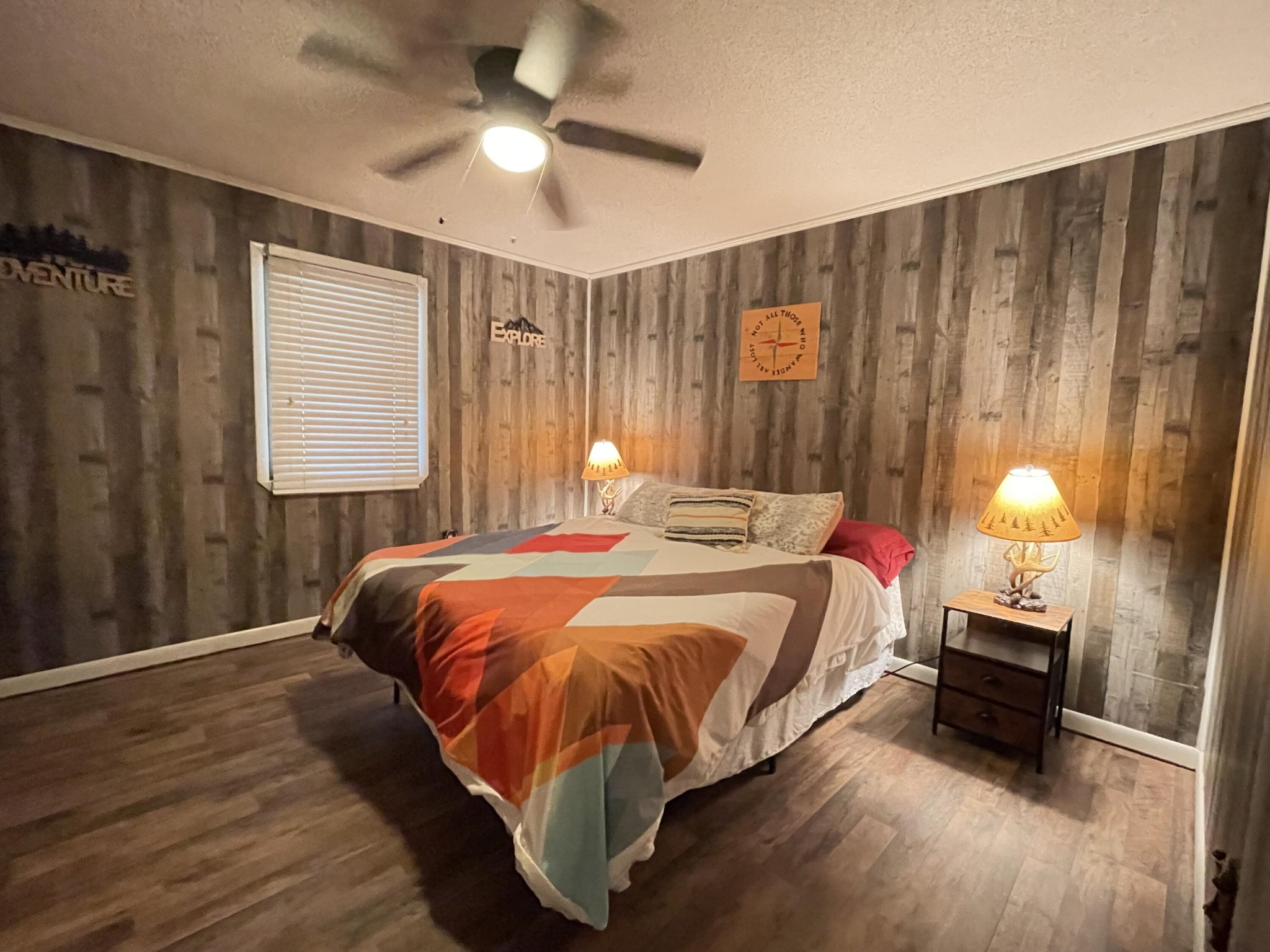 1522 Turkey Creek Road Tellico Plains, TN 37385 - Photo 19 of 34 a bed sitting in a spacious bedroom next to a window