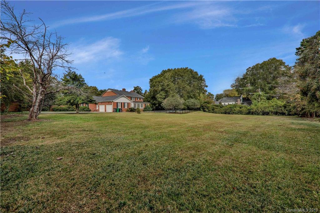 3319 Sharon Road Charlotte, NC 28211 - Photo 5 of 9 a view of a field of grass and trees