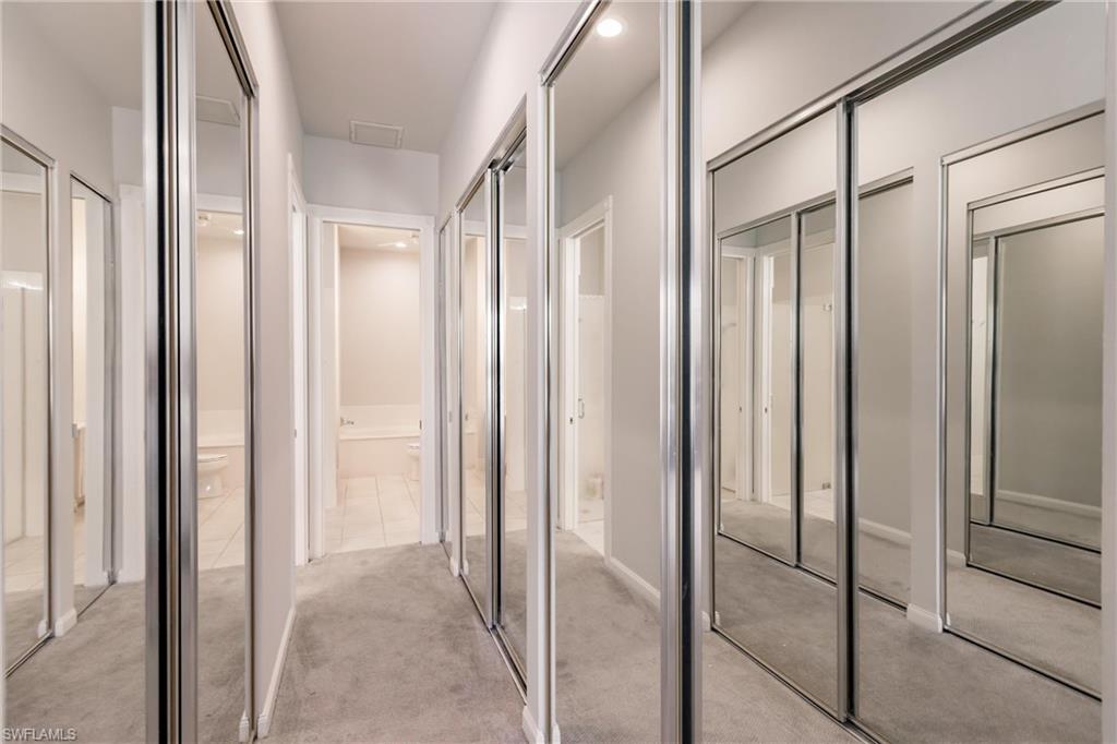 5163 Inagua Way Naples, FL 34119 - Photo 30 of 50 Hallway with light carpet