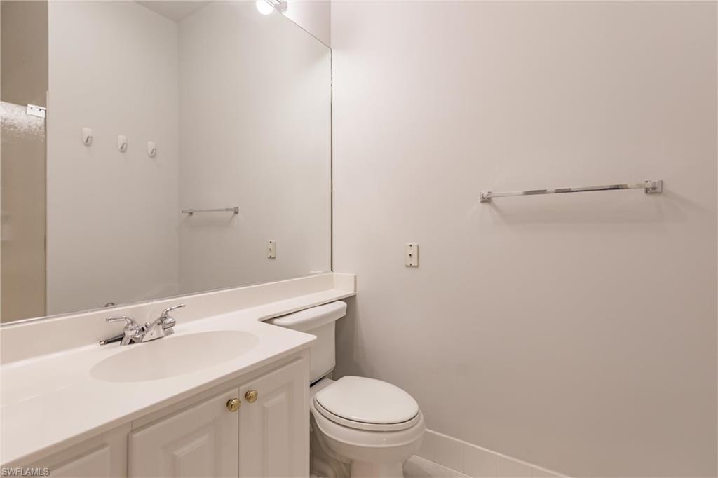 5163 Inagua Way Naples, FL 34119 - Photo 31 of 50 Bathroom with vanity and toilet