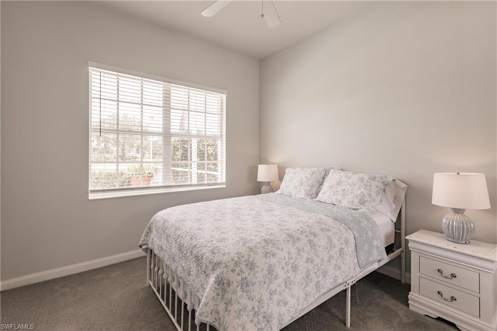 5163 Inagua Way Naples, FL 34119 - Photo 35 of 50 Carpeted bedroom featuring ceiling fan