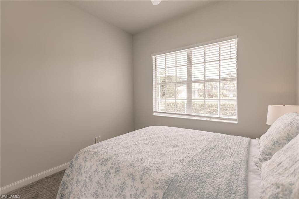 5163 Inagua Way Naples, FL 34119 - Photo 36 of 50 View of carpeted bedroom