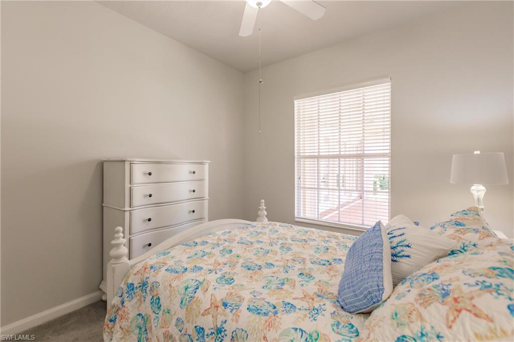5163 Inagua Way Naples, FL 34119 - Photo 41 of 50 Carpeted bedroom featuring ceiling fan