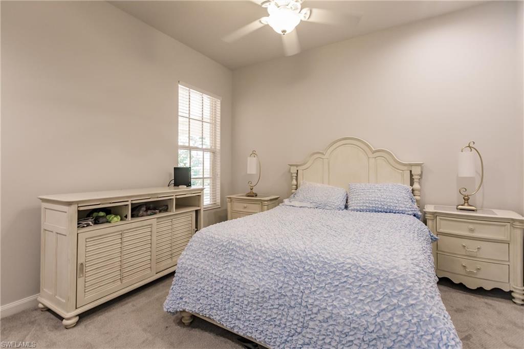 5163 Inagua Way Naples, FL 34119 - Photo 45 of 50 Carpeted bedroom with ceiling fan