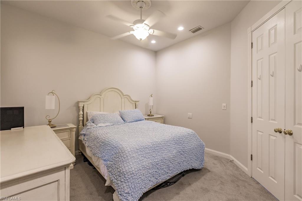 5163 Inagua Way Naples, FL 34119 - Photo 46 of 50 Carpeted bedroom with ceiling fan and a closet