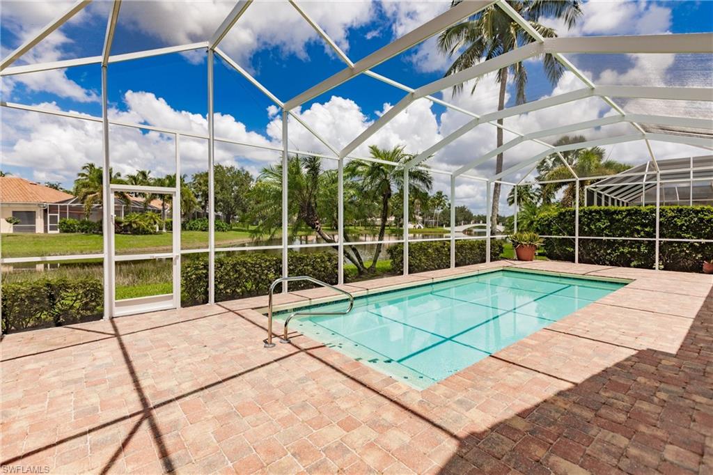 5163 Inagua Way Naples, FL 34119 - Photo 50 of 50 View of swimming pool featuring a lanai and a patio area