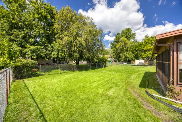 a view of a house with a back yard