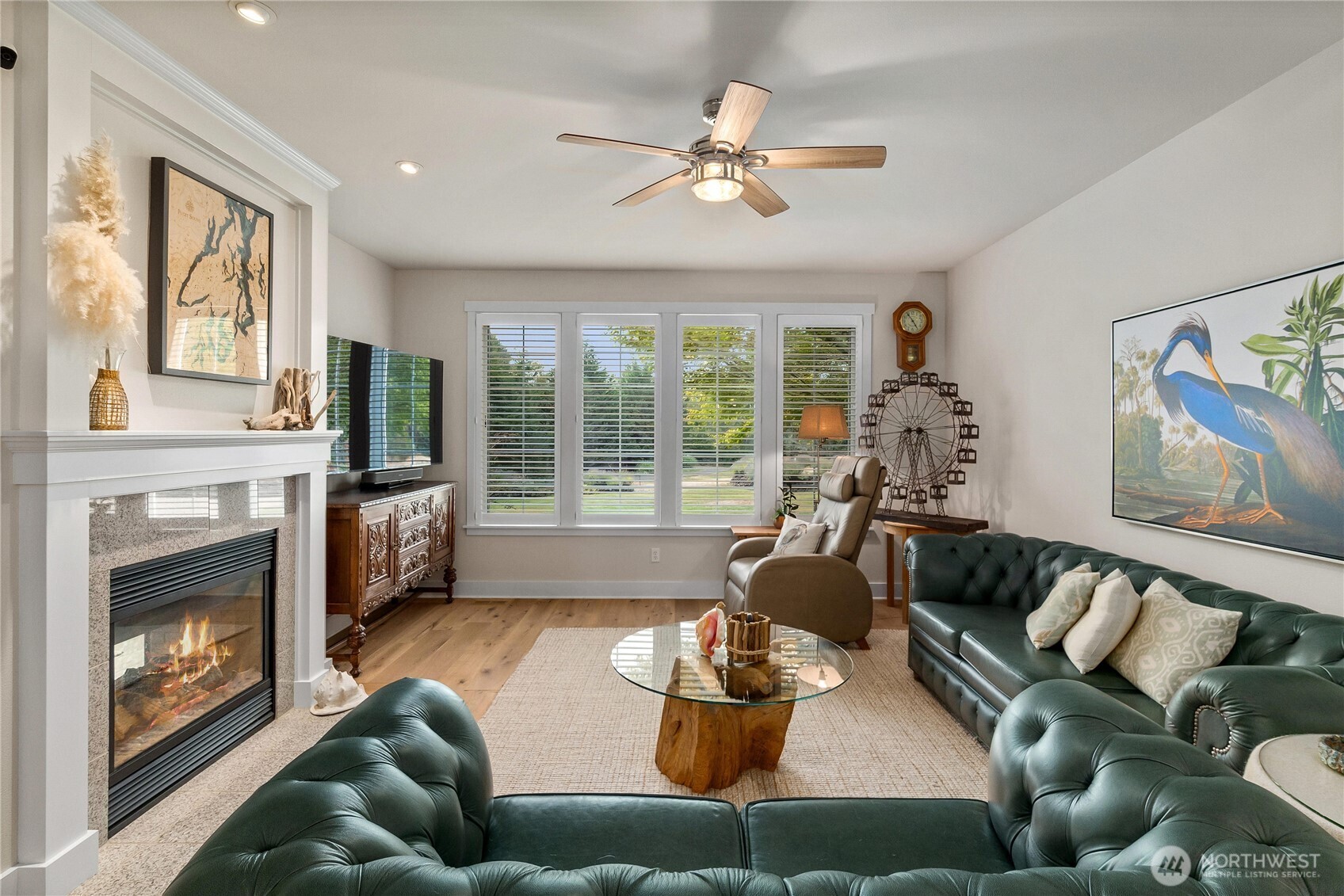9044 Hunter Point Road Northwest Olympia, WA 98502 - Photo 11 of 40 a living room with furniture and a fireplace