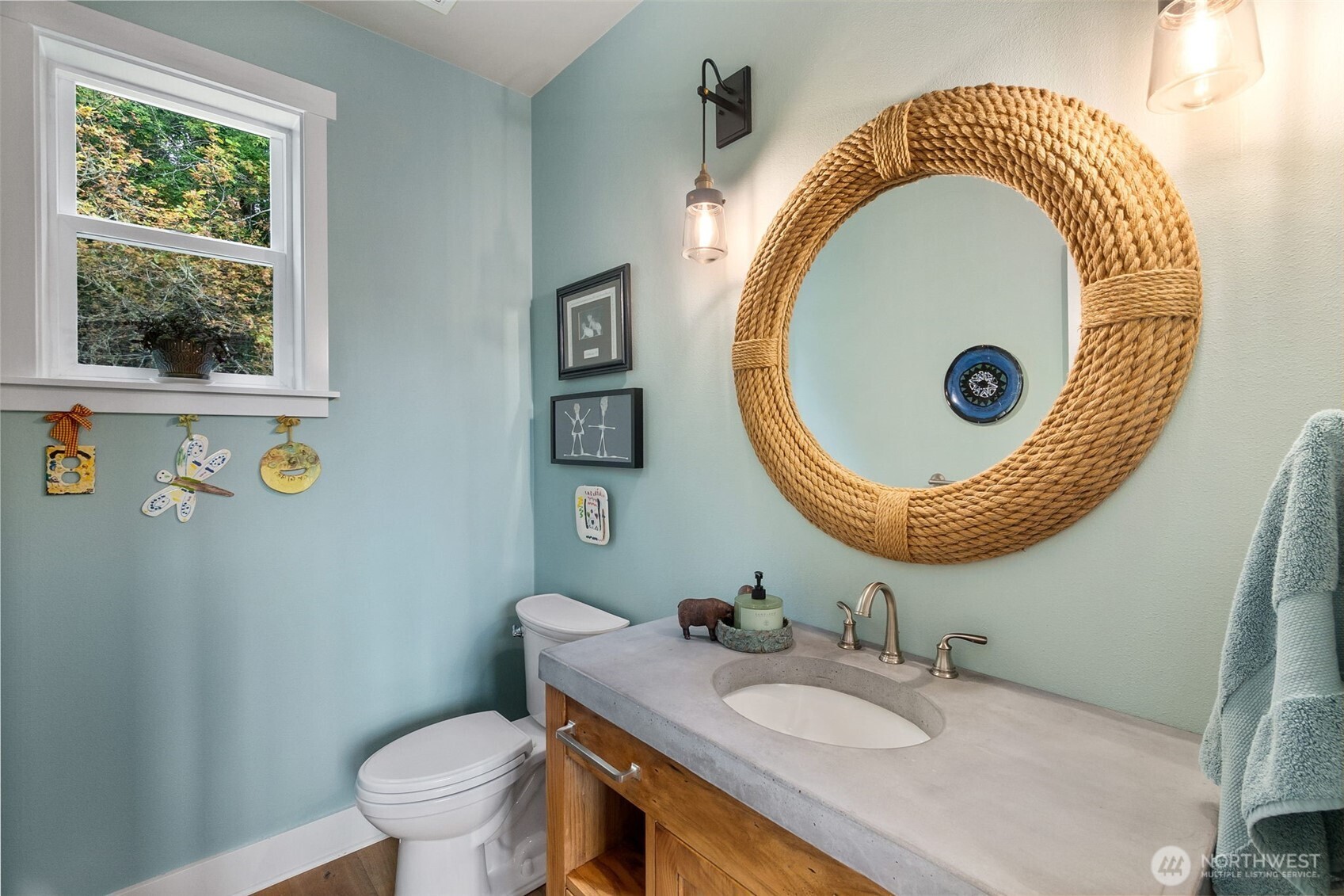 9044 Hunter Point Road Northwest Olympia, WA 98502 - Photo 19 of 40 a bathroom with a sink and a mirror