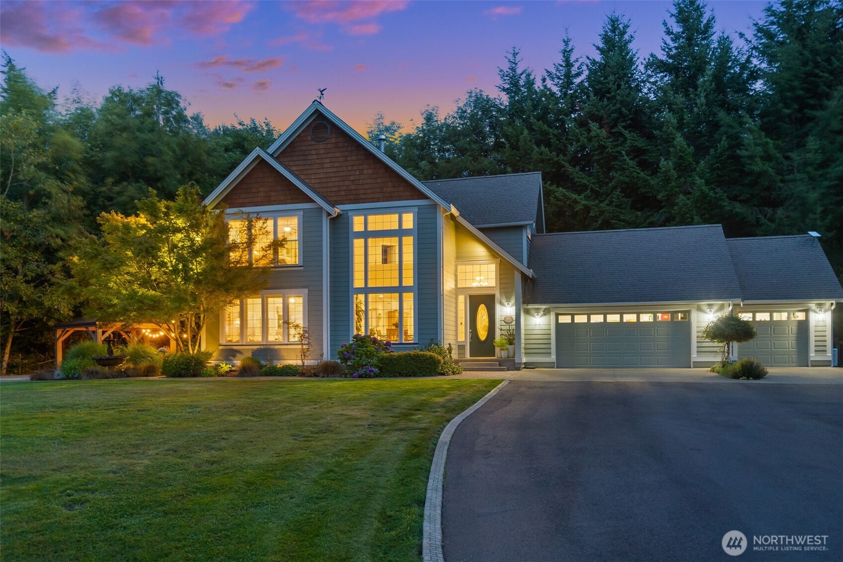 9044 Hunter Point Road Northwest Olympia, WA 98502 - Photo 2 of 40 a front view of a house with a yard