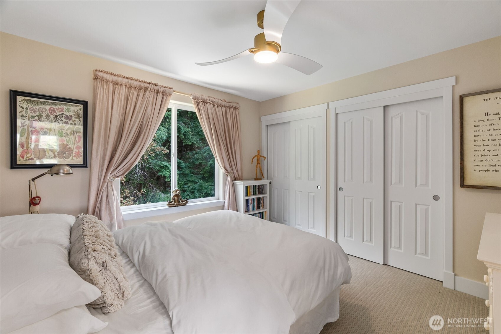 9044 Hunter Point Road Northwest Olympia, WA 98502 - Photo 22 of 40 a bedroom with a bed and a large window
