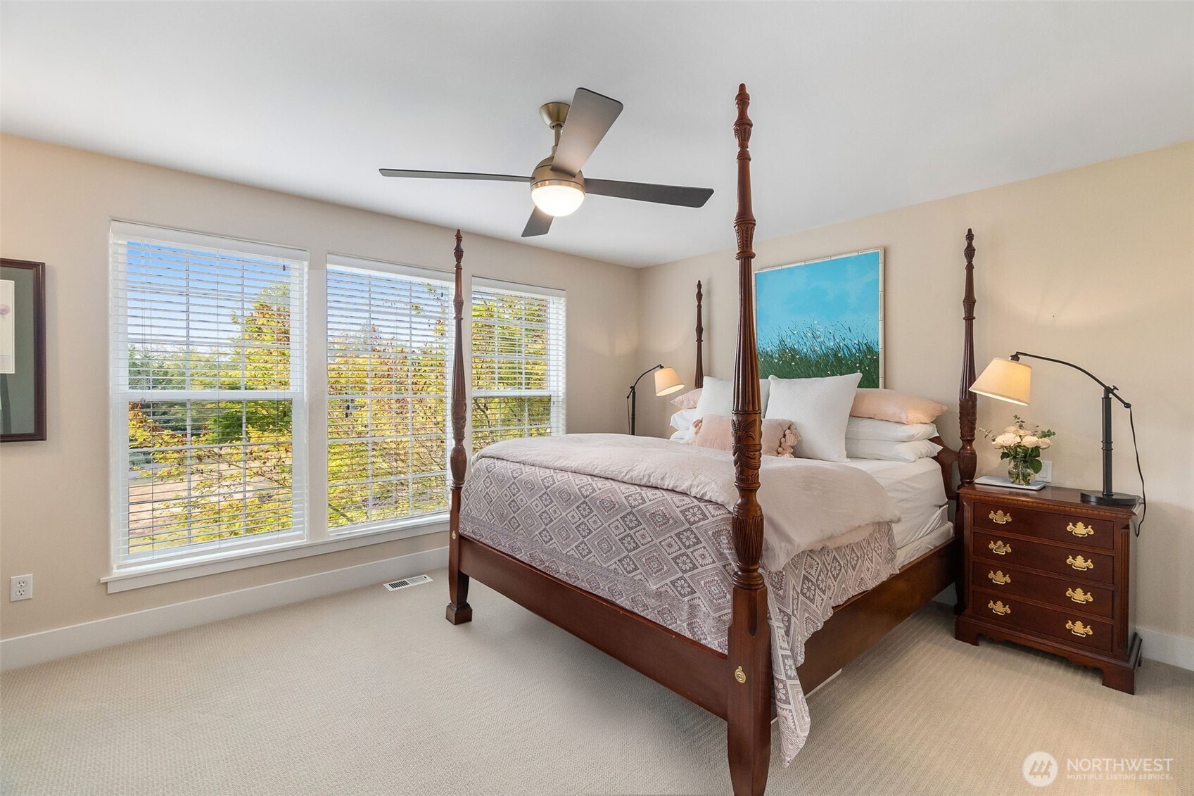 9044 Hunter Point Road Northwest Olympia, WA 98502 - Photo 25 of 40 a spacious bedroom with a bed window and walk in closet