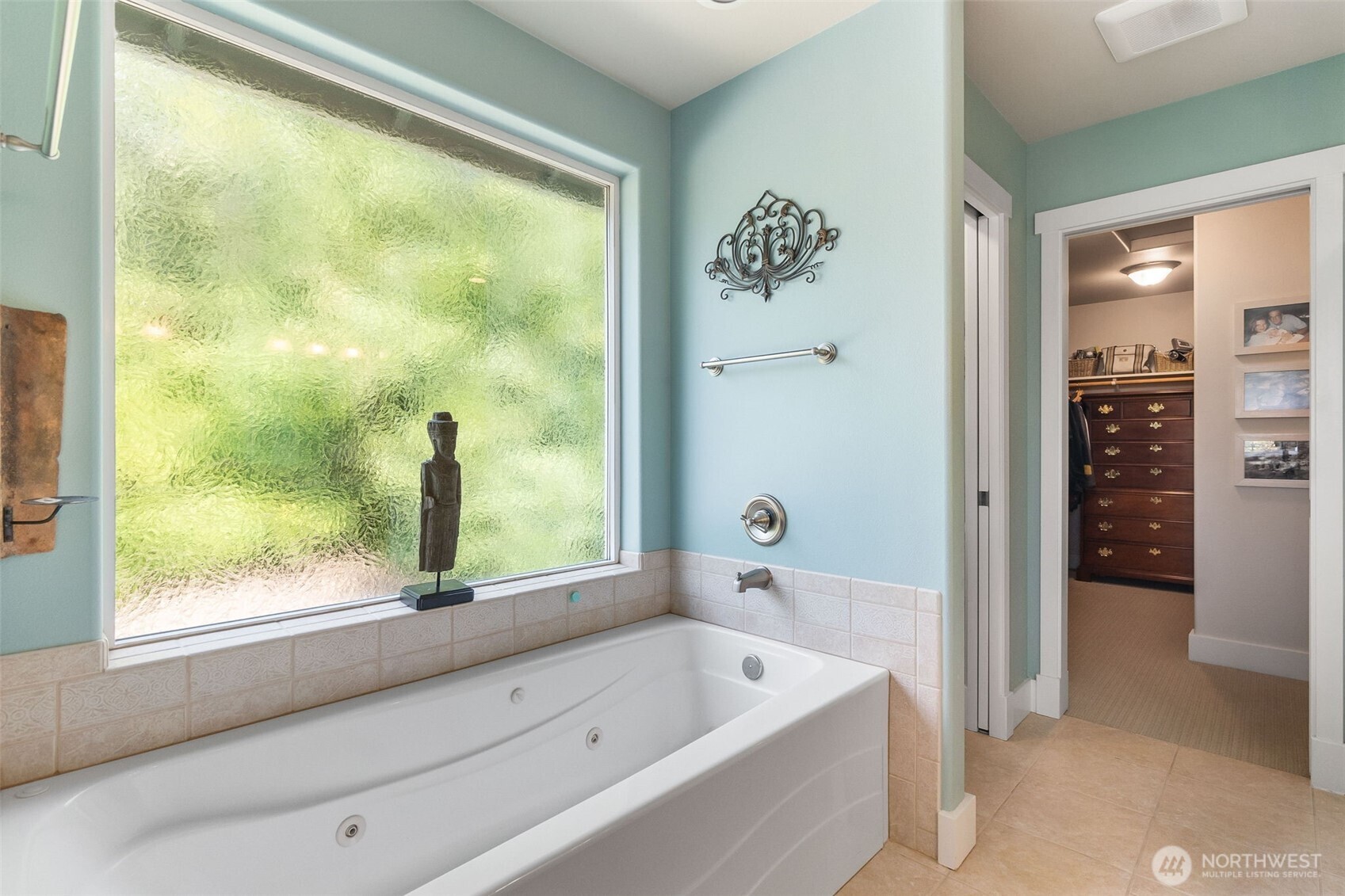 9044 Hunter Point Road Northwest Olympia, WA 98502 - Photo 27 of 40 a bathroom with a bathtub and a shower