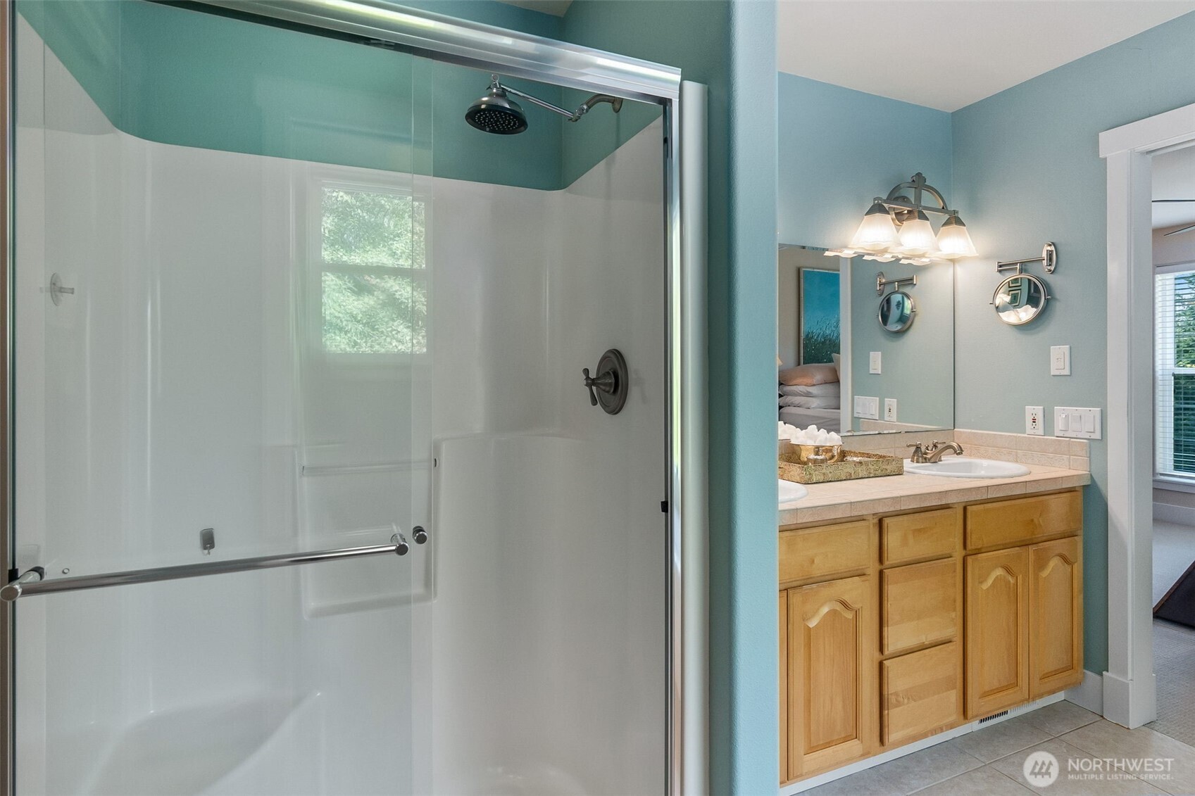 9044 Hunter Point Road Northwest Olympia, WA 98502 - Photo 28 of 40 a bathroom with a sink and a mirror