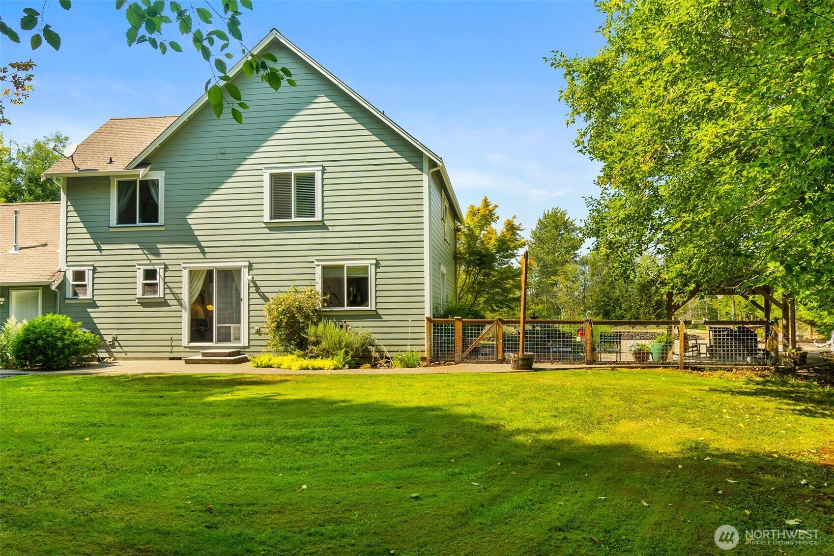 9044 Hunter Point Road Northwest Olympia, WA 98502 - Photo 30 of 40 a view of a house with a yard