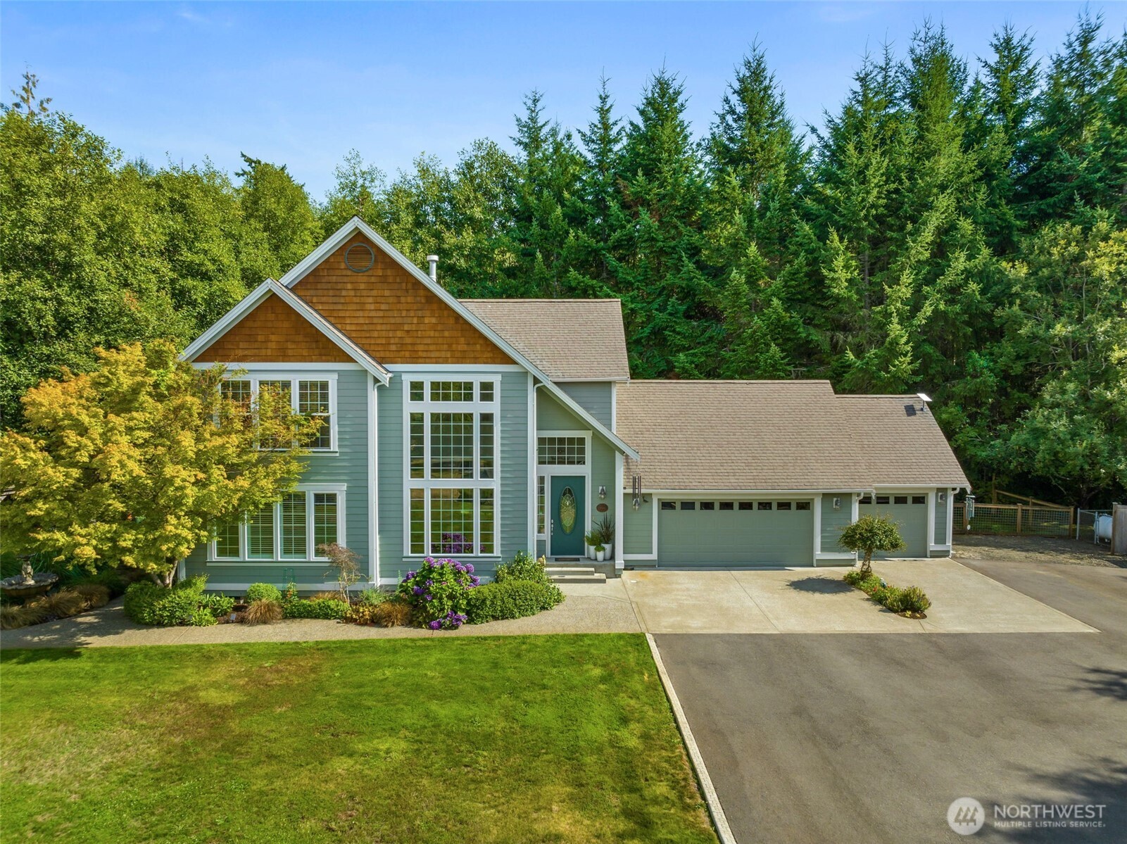 9044 Hunter Point Road Northwest Olympia, WA 98502 - Photo 4 of 40 a aerial view of a house with yard and green space