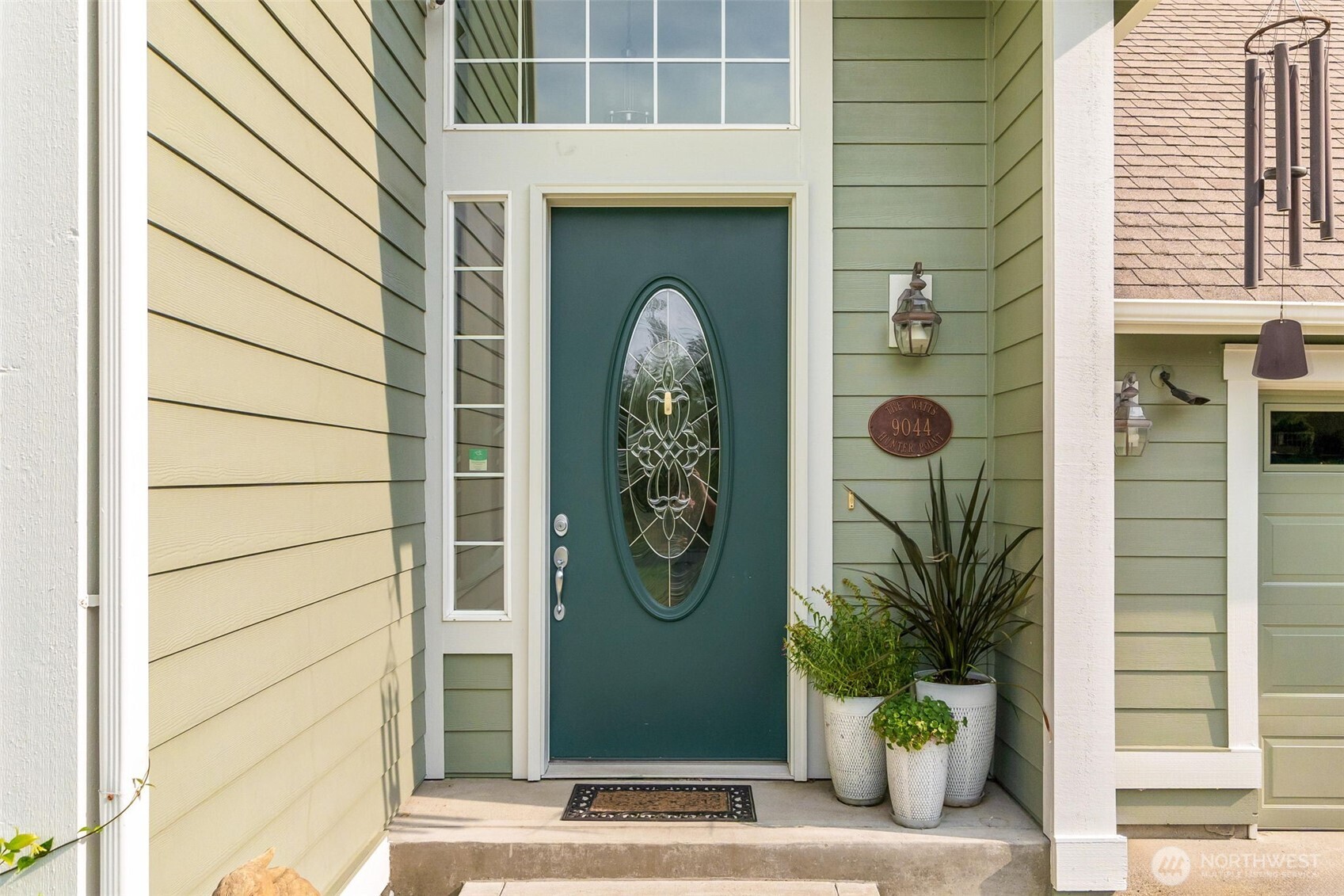 9044 Hunter Point Road Northwest Olympia, WA 98502 - Photo 5 of 40 a front view of a house with garden