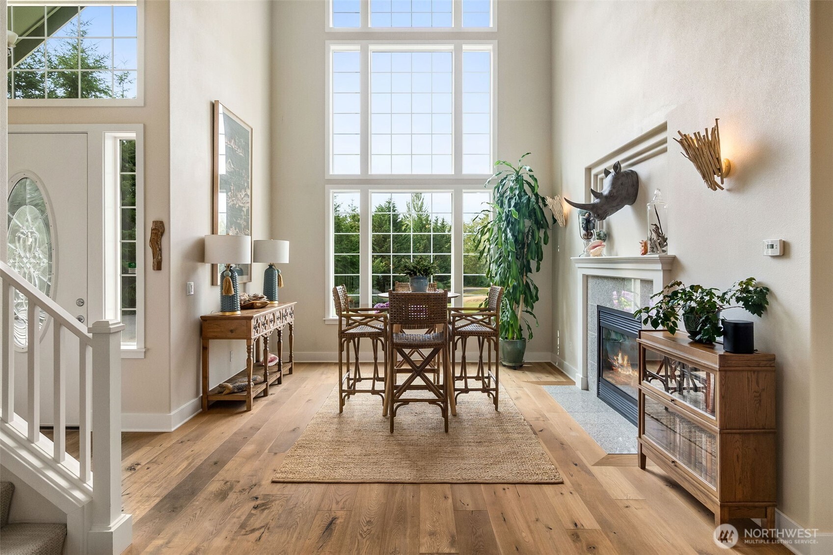 9044 Hunter Point Road Northwest Olympia, WA 98502 - Photo 7 of 40 a dining room with furniture and wooden floor