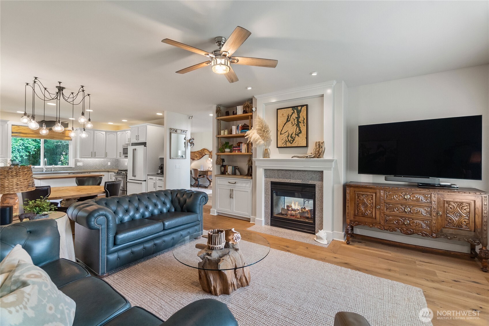 9044 Hunter Point Road Northwest Olympia, WA 98502 - Photo 10 of 40 a living room with furniture fireplace and flat screen tv