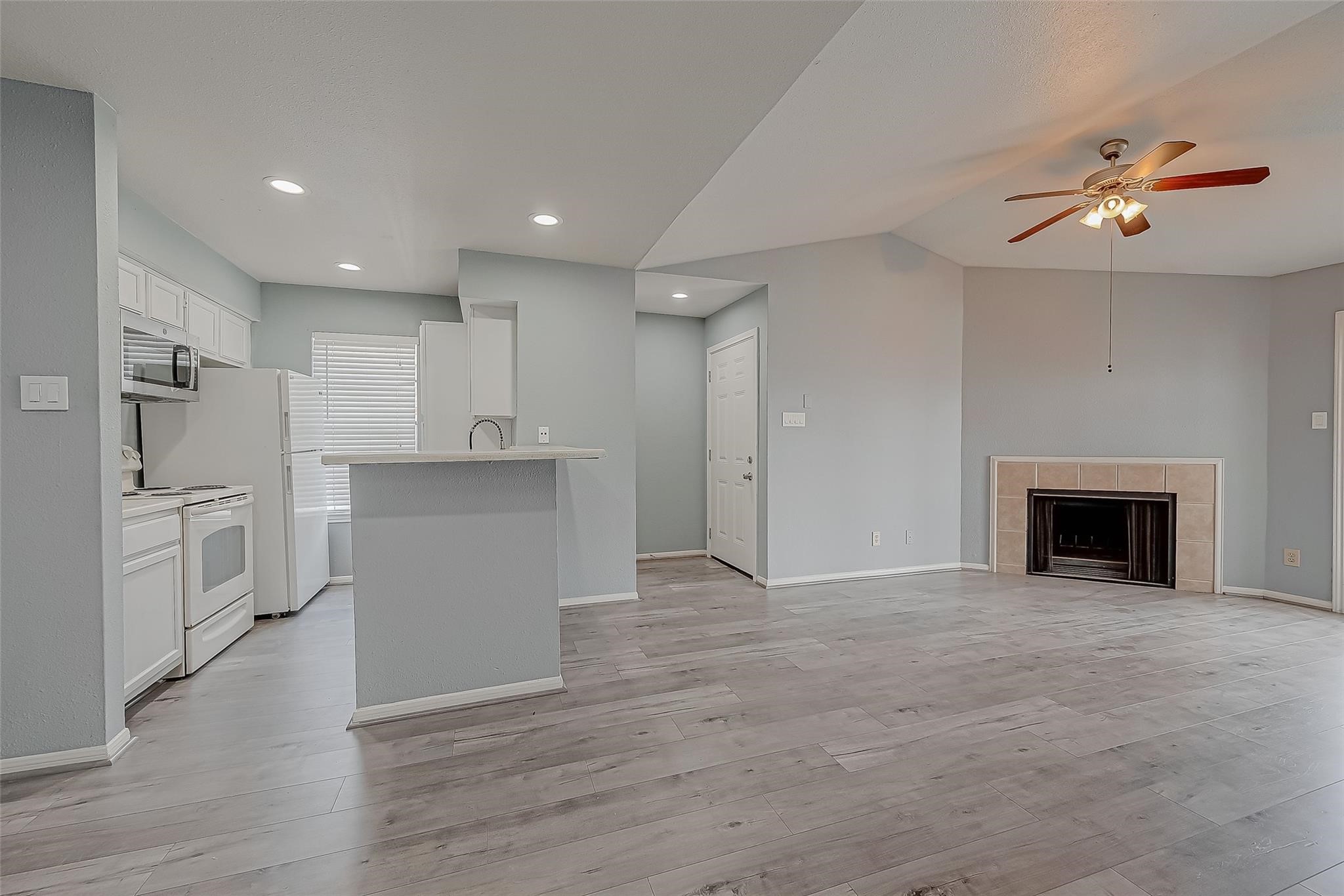 14600 Fonmeadow Drive, Unit 107 Houston, TX 77035 - Photo 13 of 27 a view of a kitchen with a sink and dishwasher cabinets