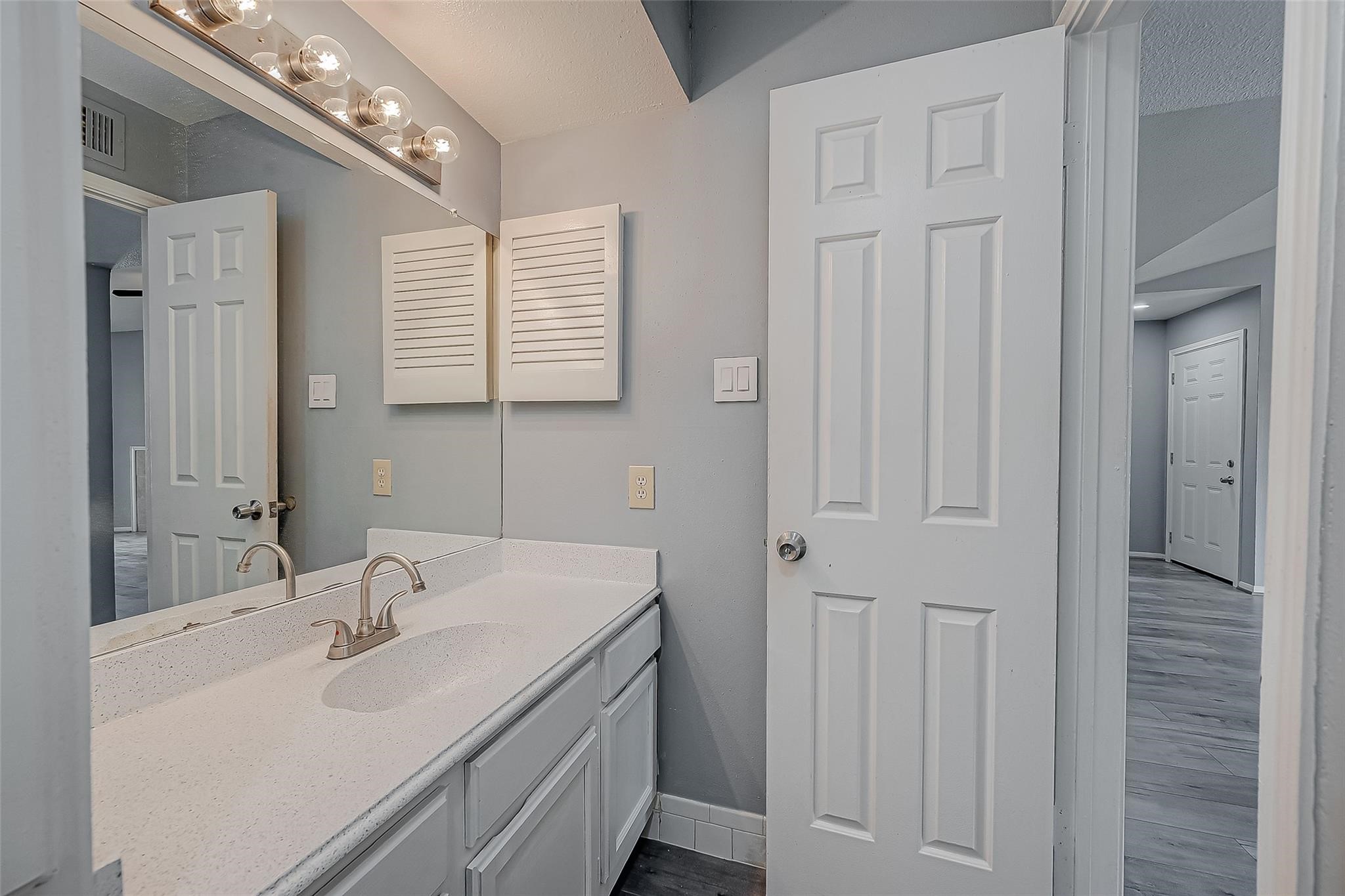 14600 Fonmeadow Drive, Unit 107 Houston, TX 77035 - Photo 22 of 27 a bathroom with a sink and a mirror