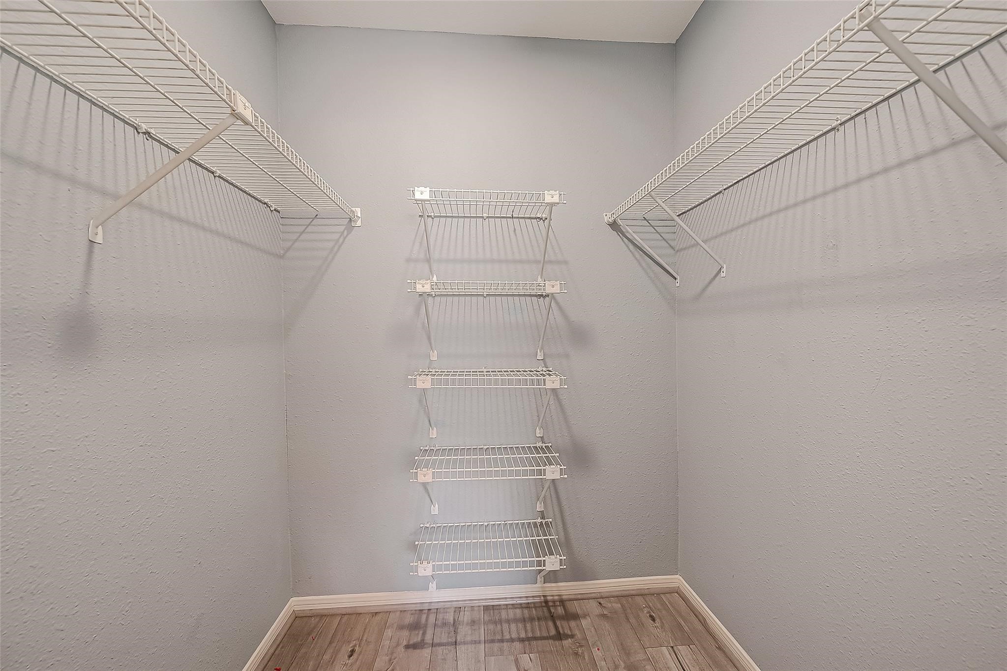 14600 Fonmeadow Drive, Unit 107 Houston, TX 77035 - Photo 24 of 27 a view of walk in closet with empty racks