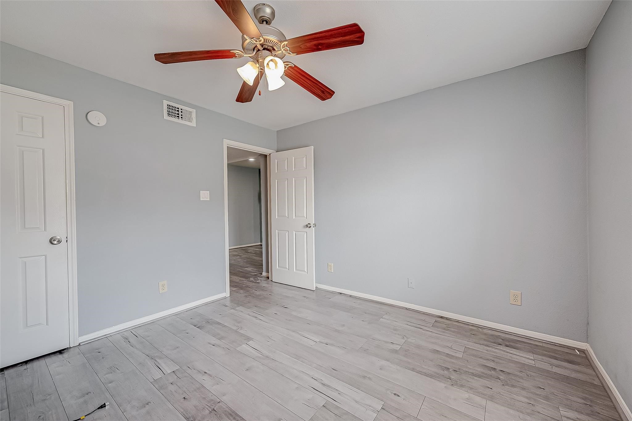 14600 Fonmeadow Drive, Unit 107 Houston, TX 77035 - Photo 25 of 27 a view of an empty room with wooden floor