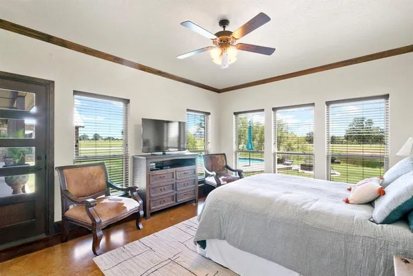 a bedroom with a bed and a couch