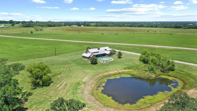 a view of a lake with a yard
