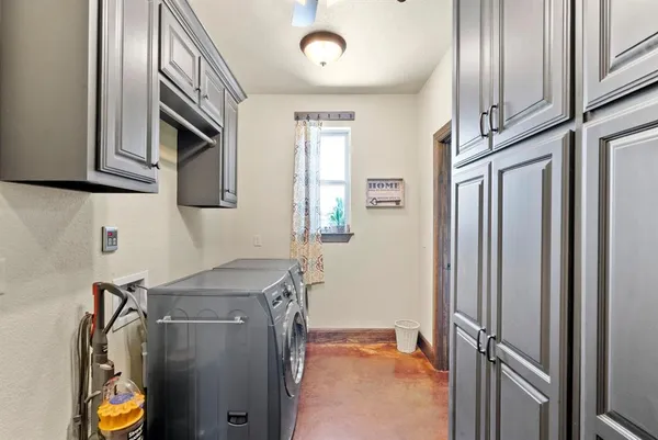 a en suite bathroom with a granite countertop sink mirror and a