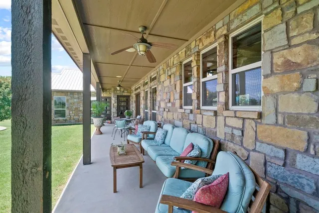 a outdoor space with patio the couches and a dining table with the view