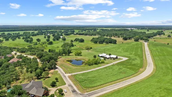 an aerial view of a golf course with swimming pool
