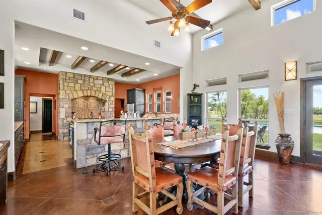 a view of a dining room with furniture window and outside view