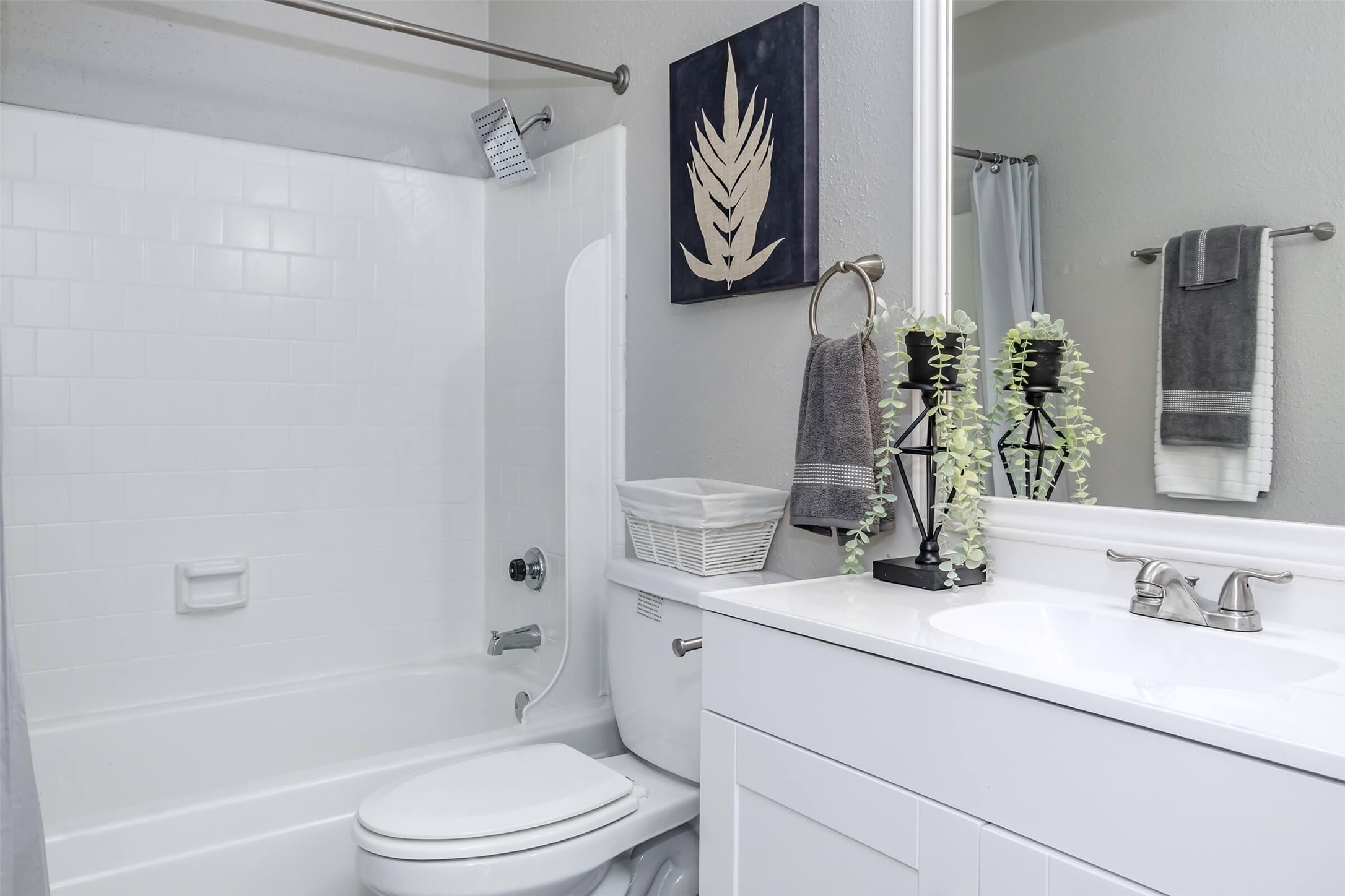 18001 Cypress Trace Road, Unit 102 Houston, TX 77090 - Photo 15 of 32 a bathroom with a sink a toilet and shower