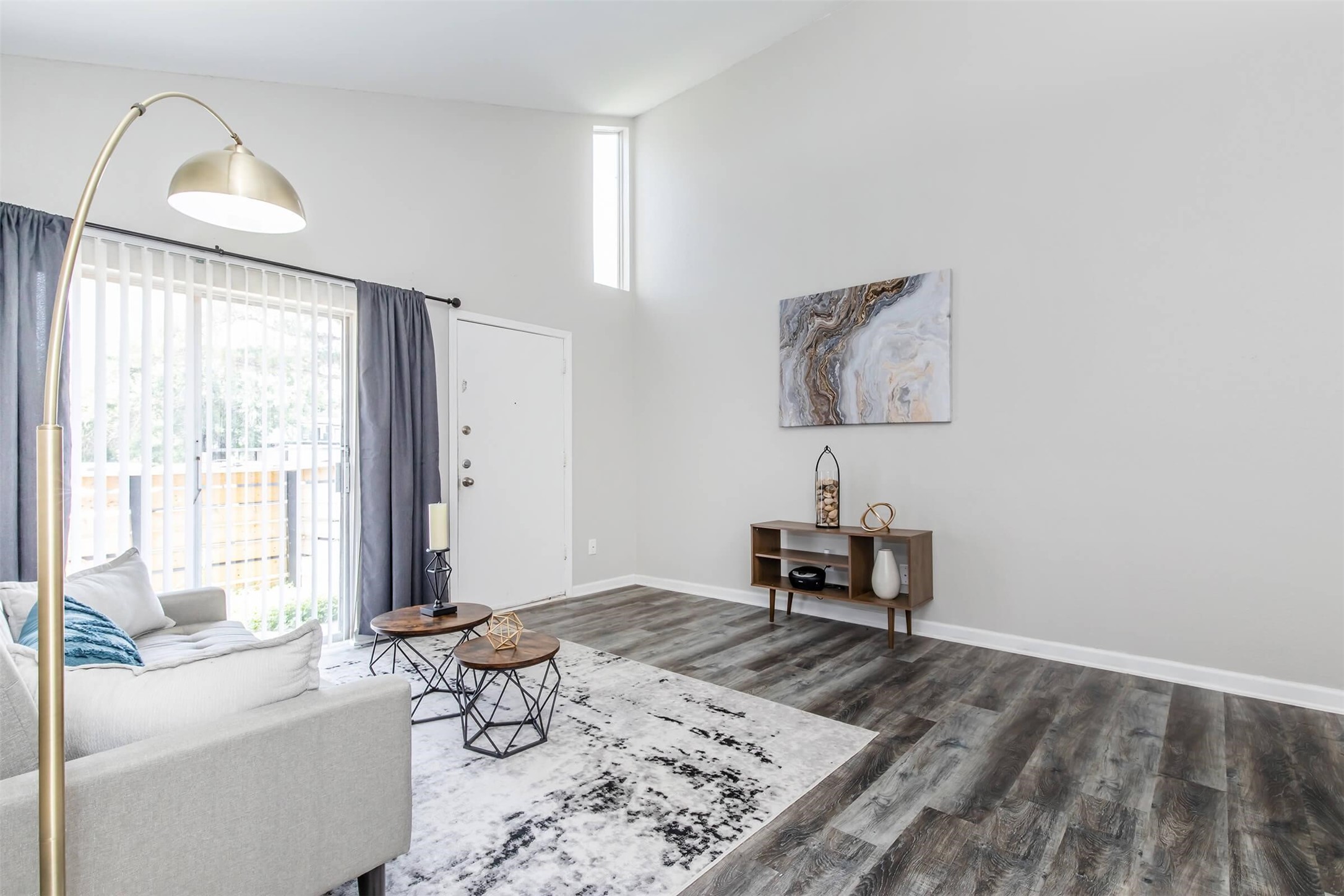 18001 Cypress Trace Road, Unit 102 Houston, TX 77090 - Photo 2 of 32 a bedroom with furniture and a window