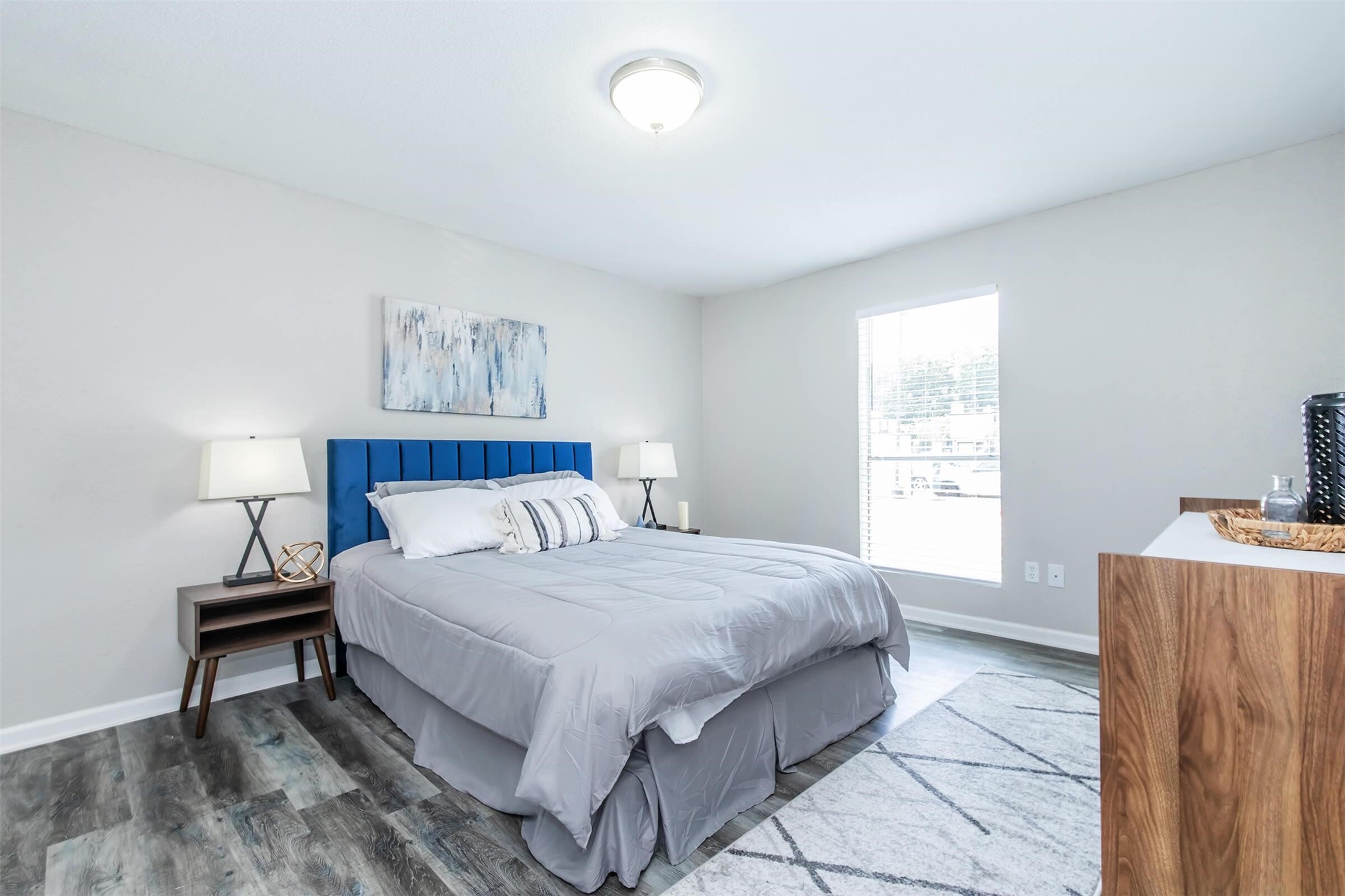 18001 Cypress Trace Road, Unit 102 Houston, TX 77090 - Photo 8 of 32 a bedroom with a bed and a window