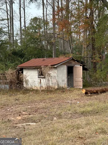 a house that has a tree in front of it