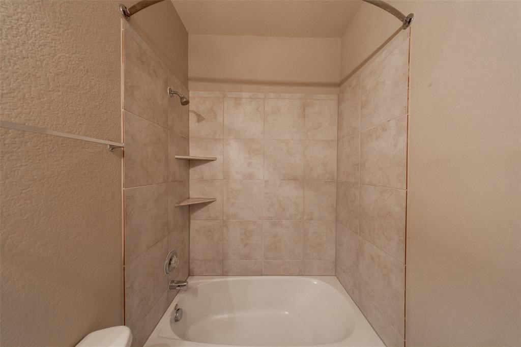 3511 Goldleaf Trail Drive Katy, TX 77449 - Photo 15 of 21 a bathroom with a shower and a bath tub