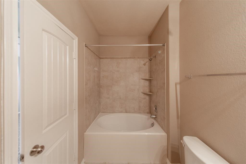3511 Goldleaf Trail Drive Katy, TX 77449 - Photo 19 of 21 a bathroom with a bathtub and a toilet