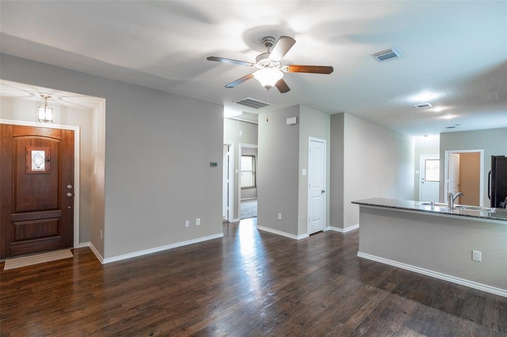 3511 Goldleaf Trail Drive Katy, TX 77449 - Photo 4 of 21 wooden floor in an empty room with a window