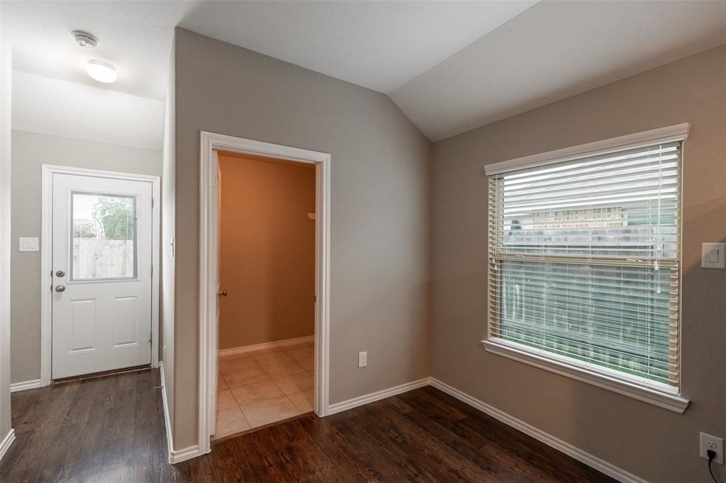 3511 Goldleaf Trail Drive Katy, TX 77449 - Photo 7 of 21 a view of an empty room with wooden floor and a window
