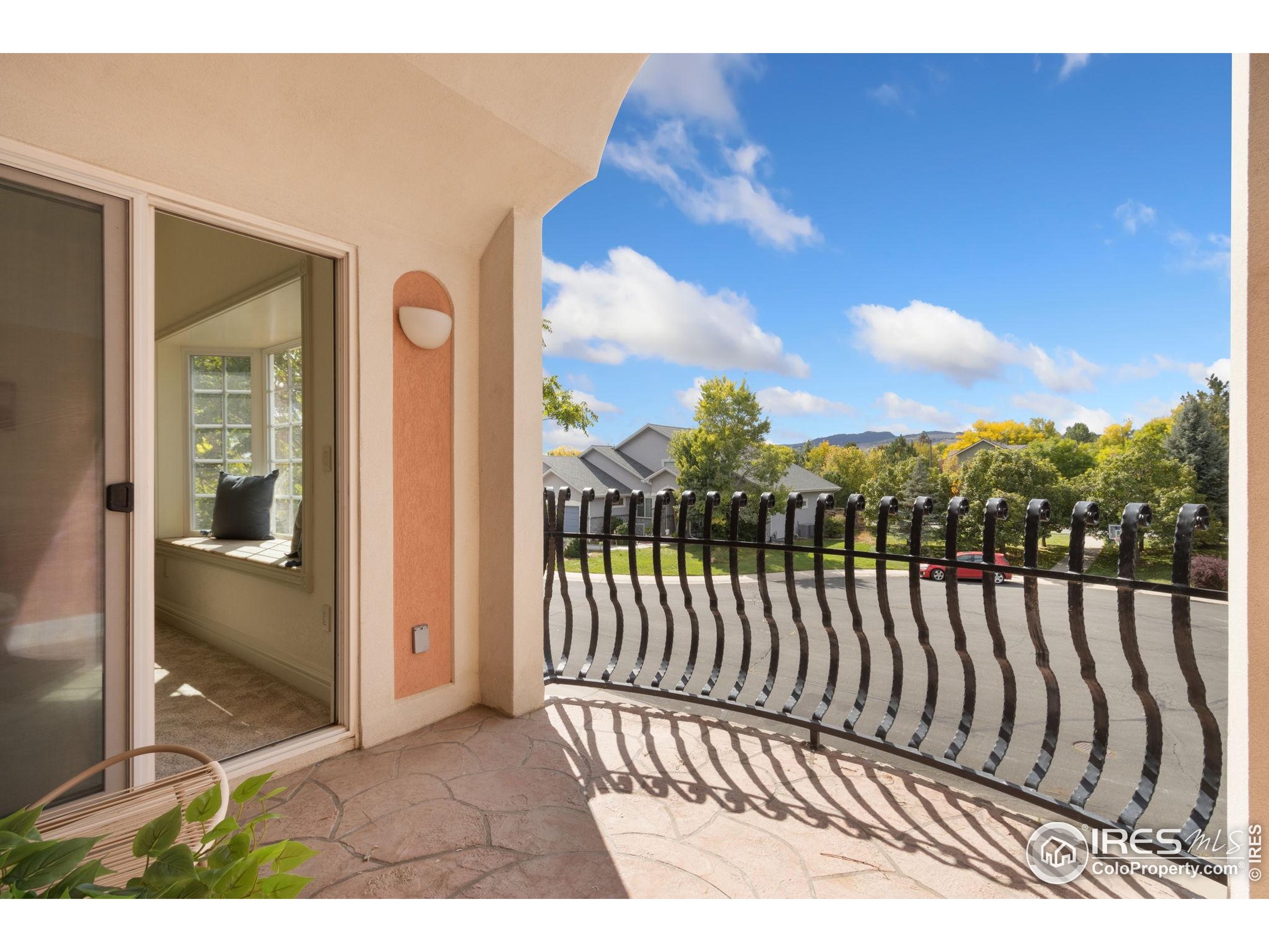 3908 Westfield Court Fort Collins, CO 80526 - Photo 21 of 45 a view of a porch with a floor to ceiling window