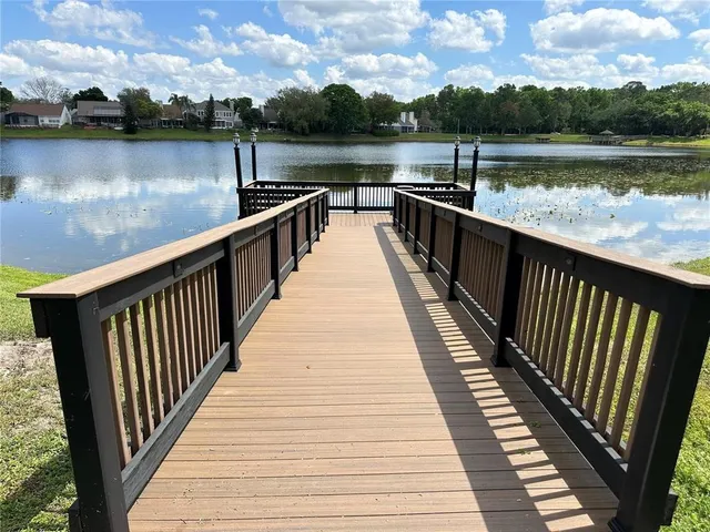 a view of wooden deck and lake