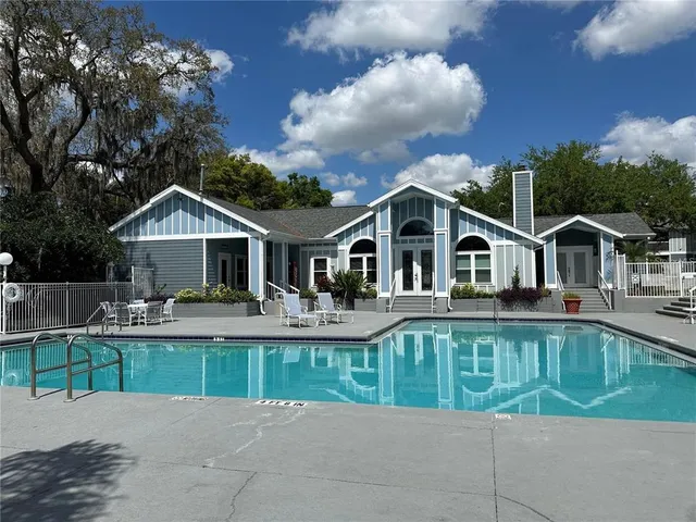 a view of a swimming pool with a patio
