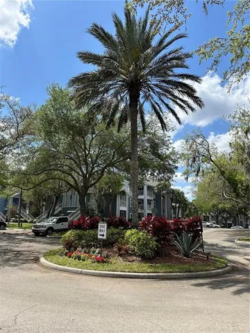 a view of a fountain in front of a house
