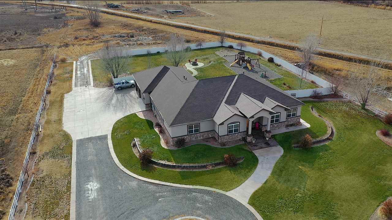 an aerial view of a house with outdoor space