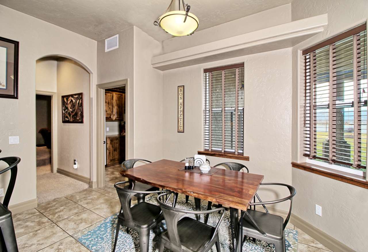 2029 K Road Fruita, CO 81521 - Photo 12 of 39 a view of a dining room with furniture and chandelier